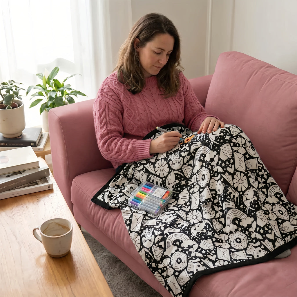 Colouring a Snuggle It blanket on the couch
