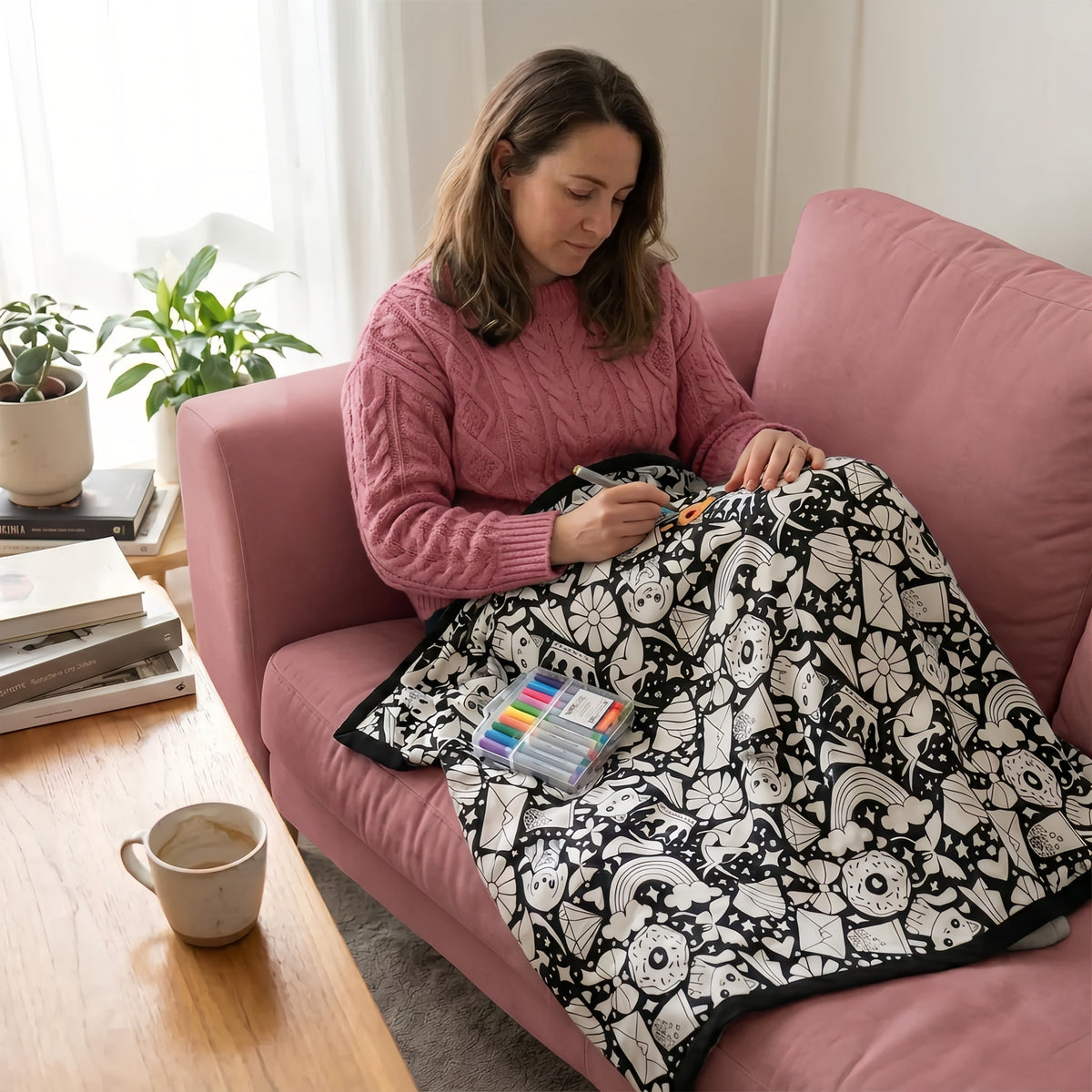 Colouring a Snuggle It blanket on the couch